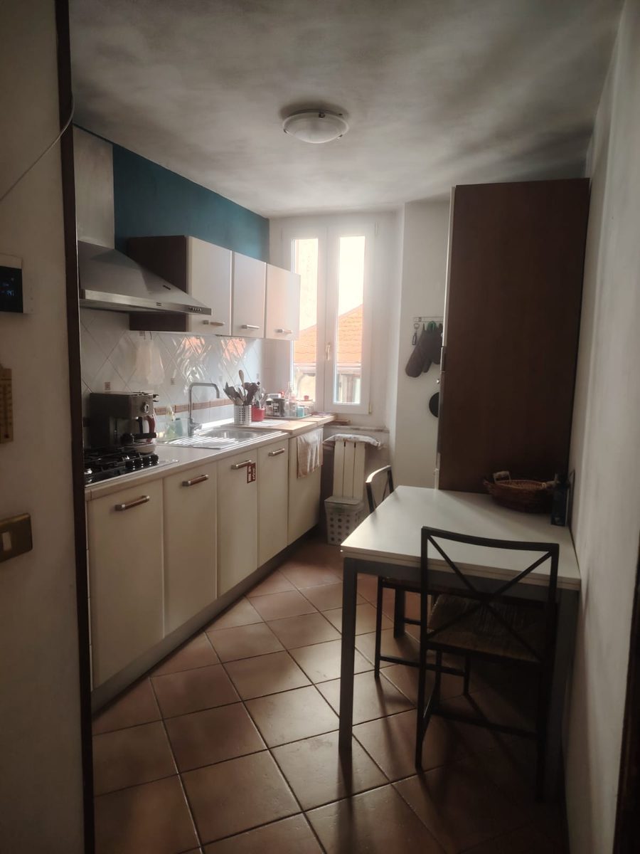 Kitchen with gas hob and espresso machine