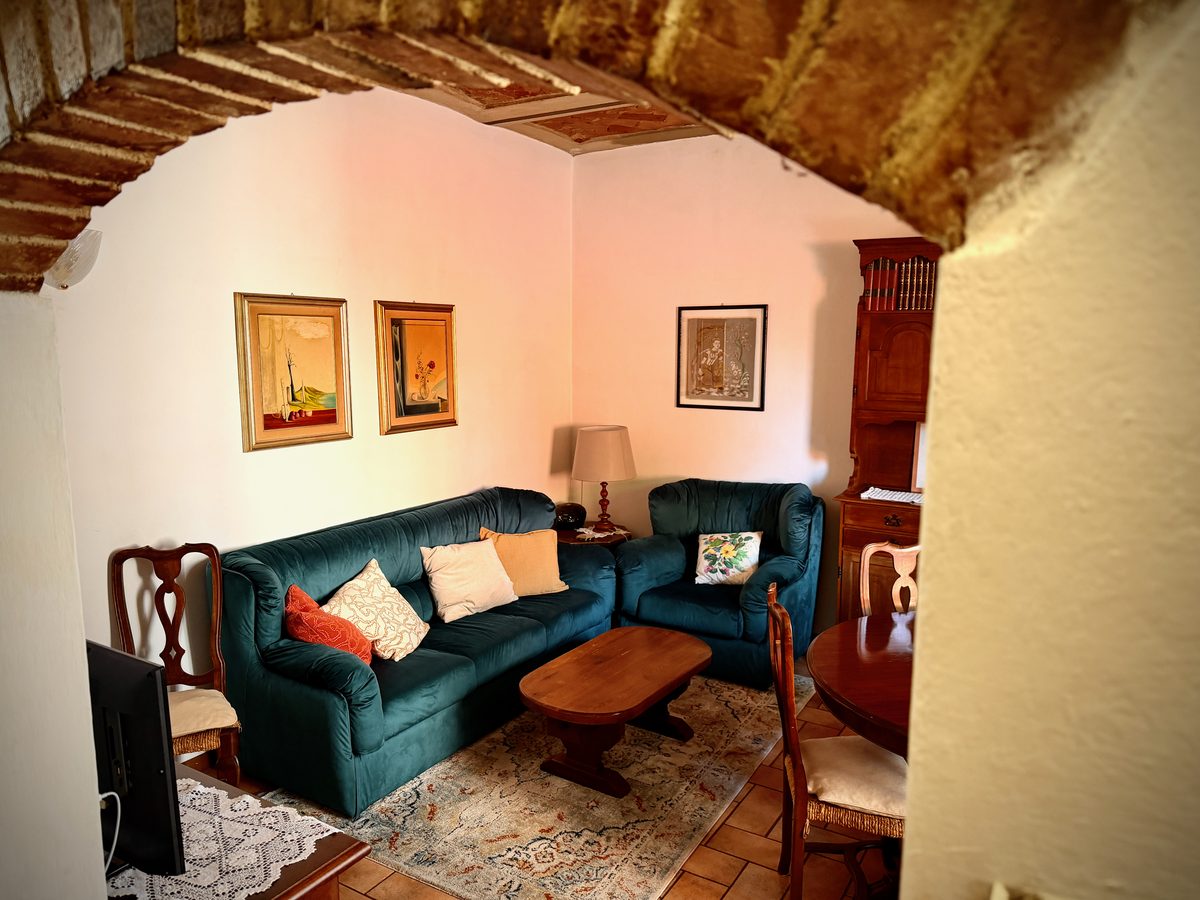 Cozy sofa and armchair corner in the il Nido living room