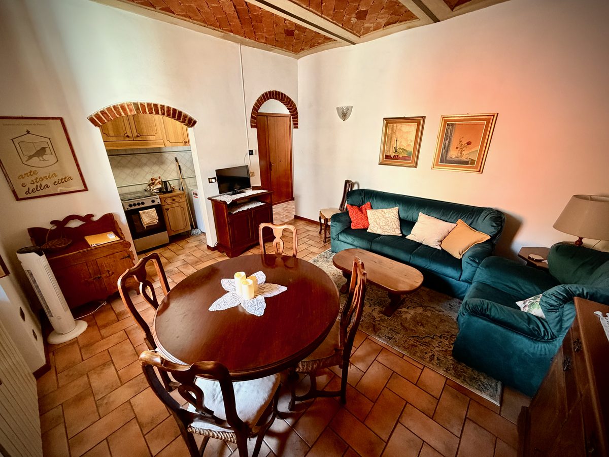 il Nido living room with terracotta floor and Tuscan wooden furniture